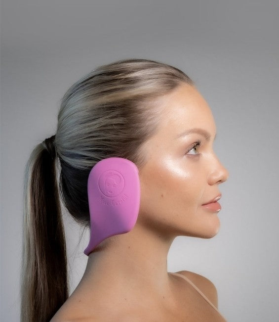 side view of white woman wearing Miss Careful ear covers