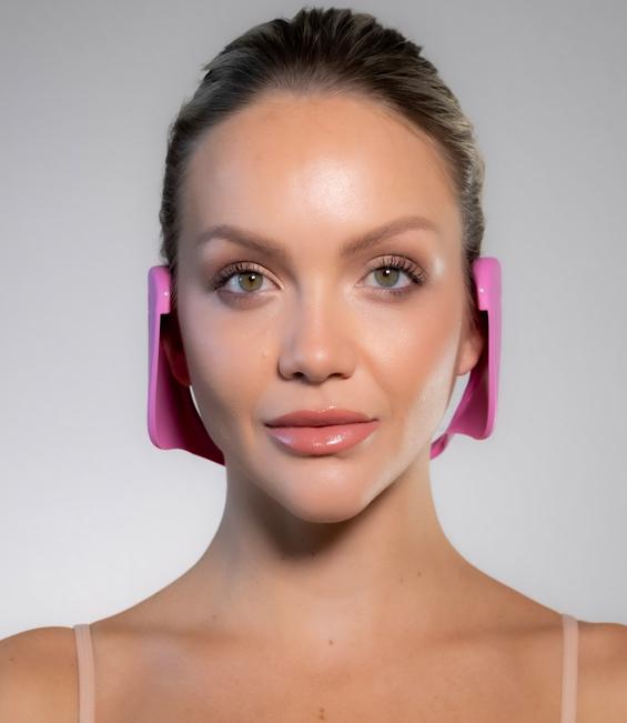 front facing woman model wearing pink Miss Careful ear covers
