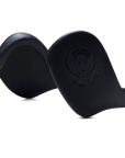 Black variant of Miss Careful brand Ear Covers to help protect ears from hot tools and dyes. Close up showing plain black color and Miss Careful logo on the ear covers.