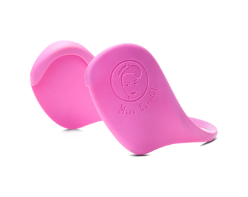 Pink variant of Miss Careful brand Ear Covers to help protect ears from hot tools and dyes. Close up showing plain black color and Miss Careful logo on the ear covers.
